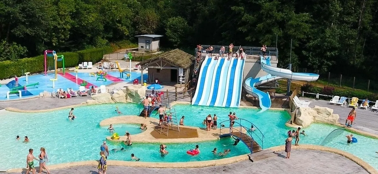 Swimming pool with slide at Le Val de Bonnal campsite.
