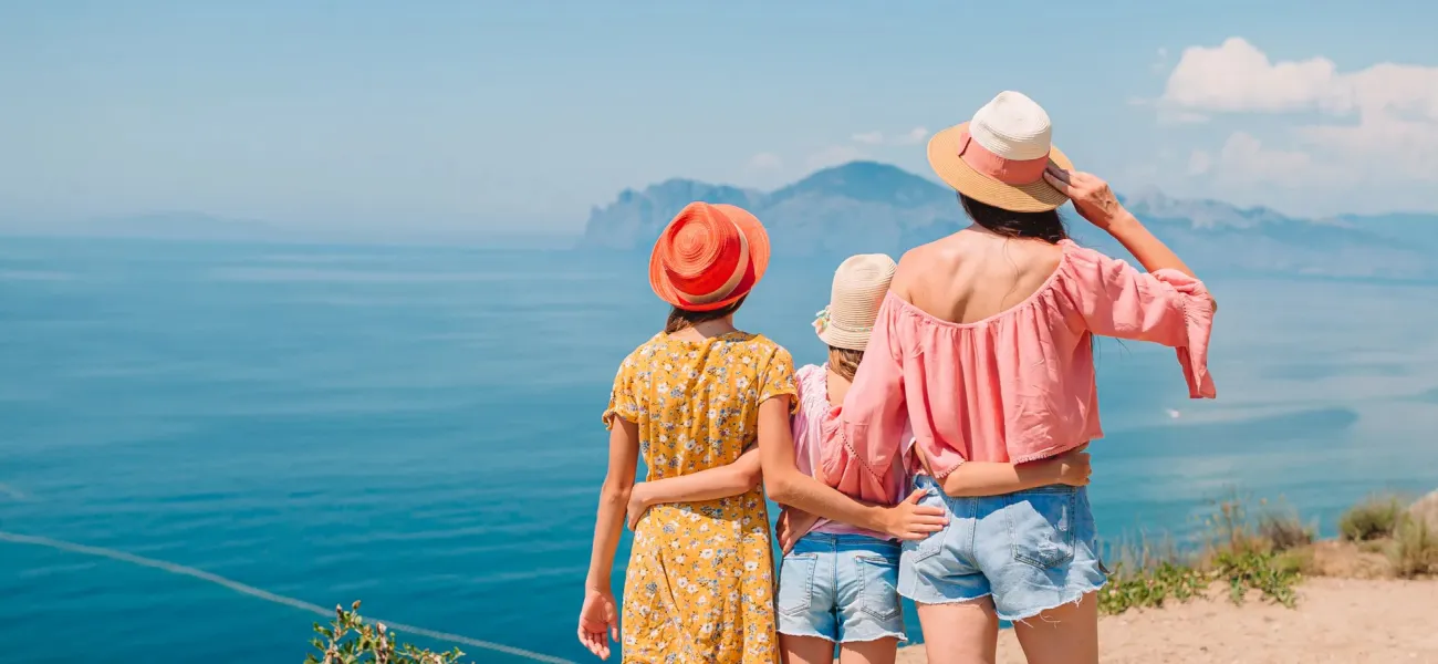 Holidaymakers look out to sea near a Roan campsite.