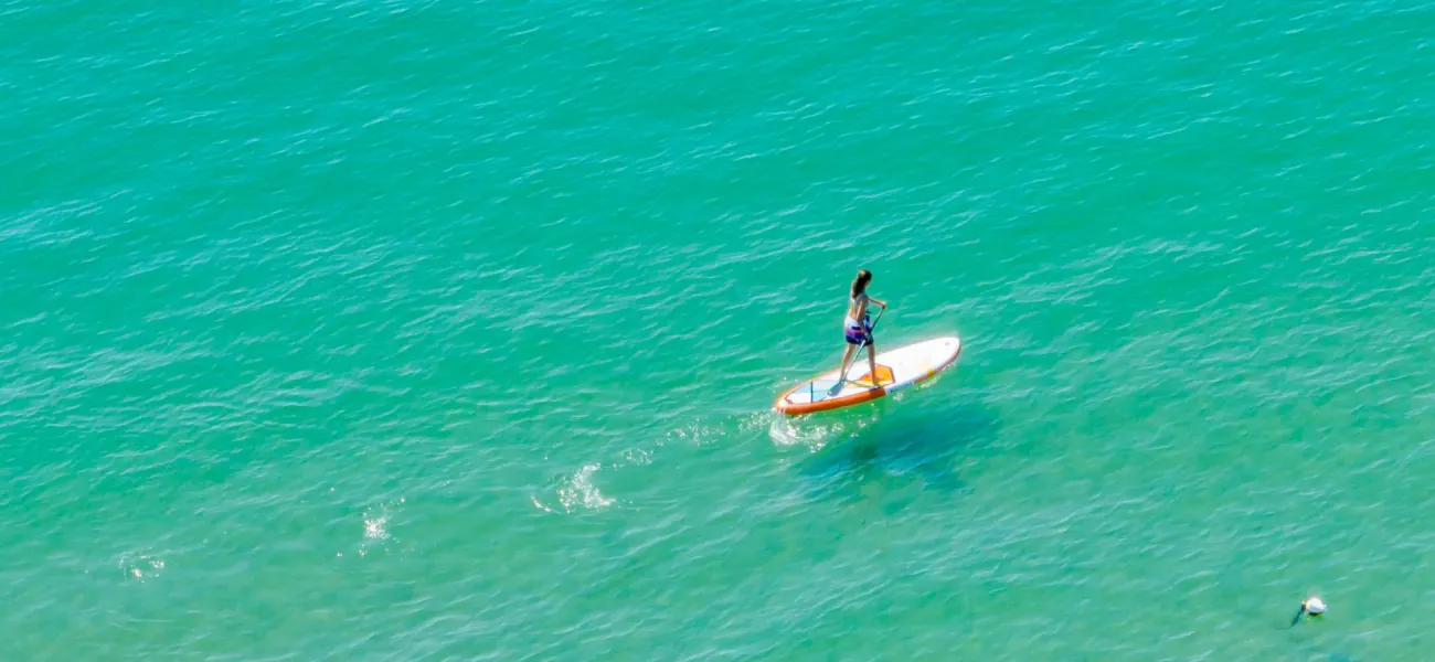 Stand-up paddleboarding at sea at a Roan campsite near Lido di Jesolo.